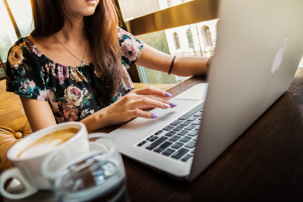 Person At Laptop With Coffee